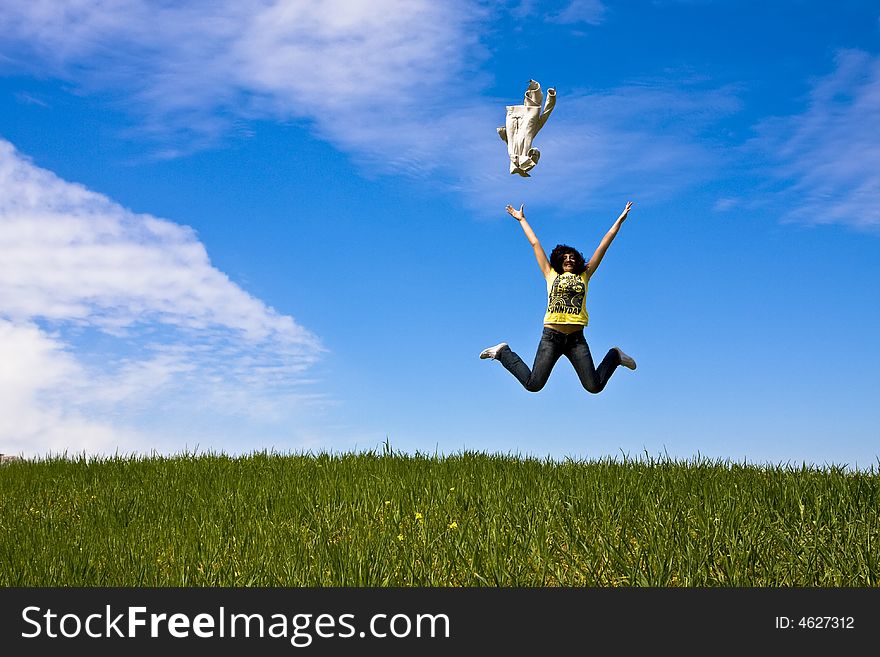 Happy woman throwing her jacket to the air. Happy woman throwing her jacket to the air.