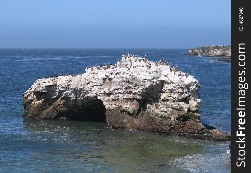 A beach cove and rock formation in Santa Cruz California.