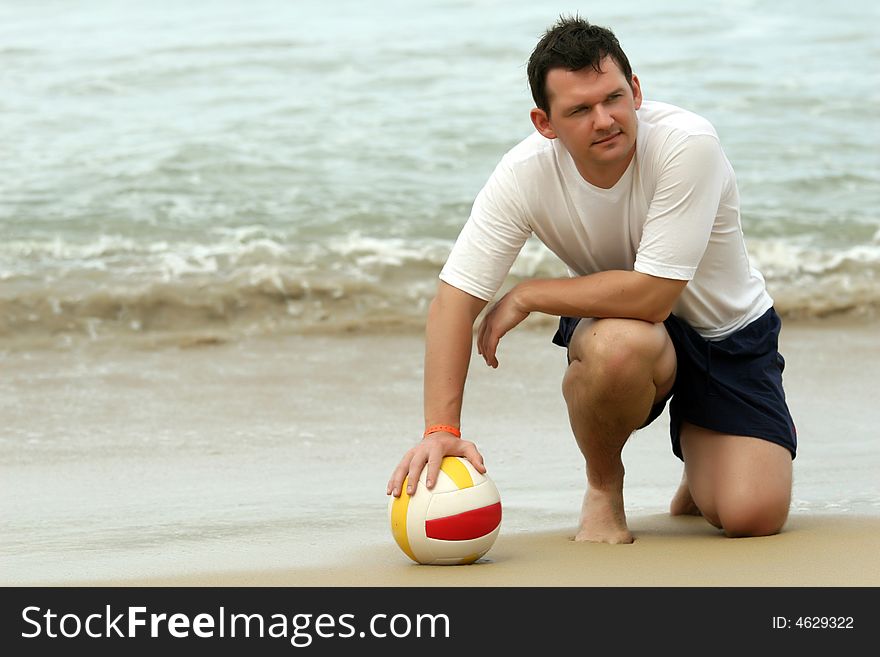 Man holding volleyball on the beach. Man holding volleyball on the beach