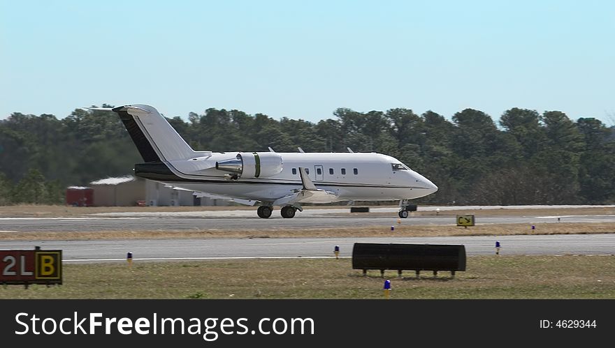Private Jet Taxiing on Runway