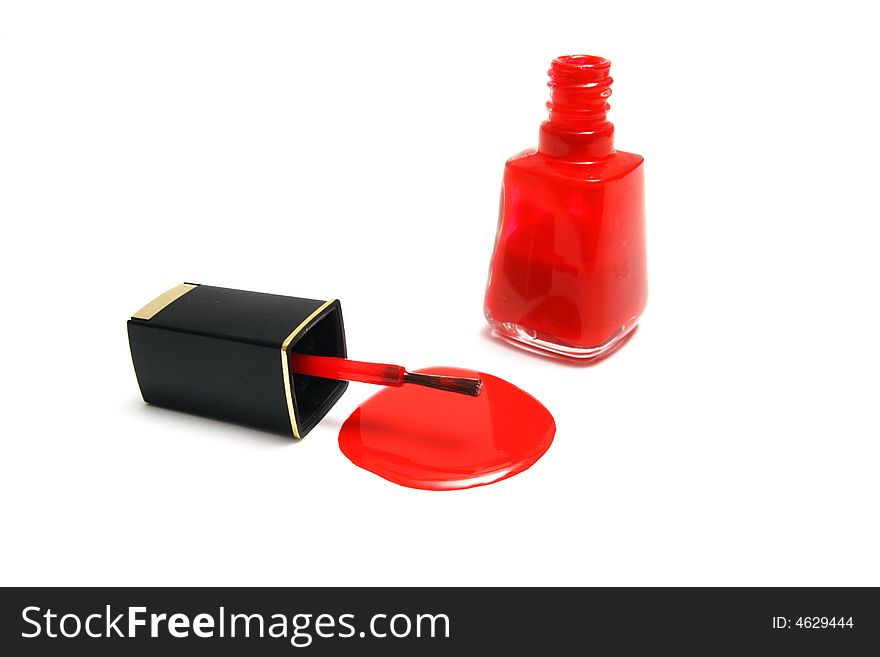 A leaking brush and jar of red nail polish