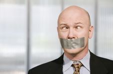 Cross-eyed Businessman Muzzled With Duct Tape Stock Image Cross-eyed Businessman Muzzled With Duct Tape Stock Image