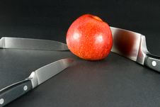 Apple And Knives Royalty Free Stock Photos