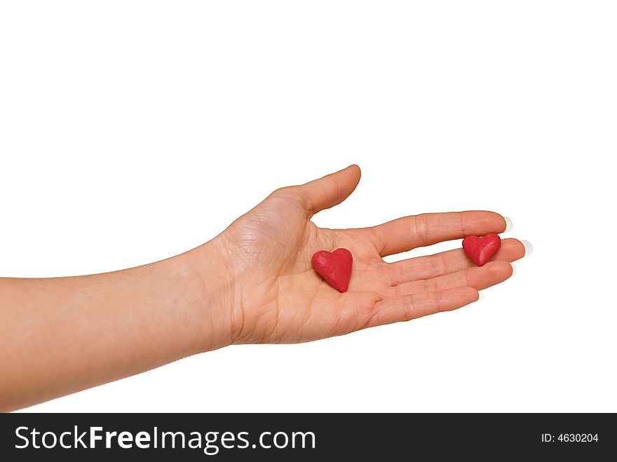 Little red plasticine  hearts on the woman hand. Little red plasticine  hearts on the woman hand