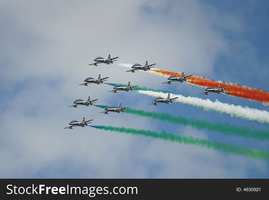 Italian squadron of ten aircraftss with coloured smoke traces symbolizing the Italian flag.