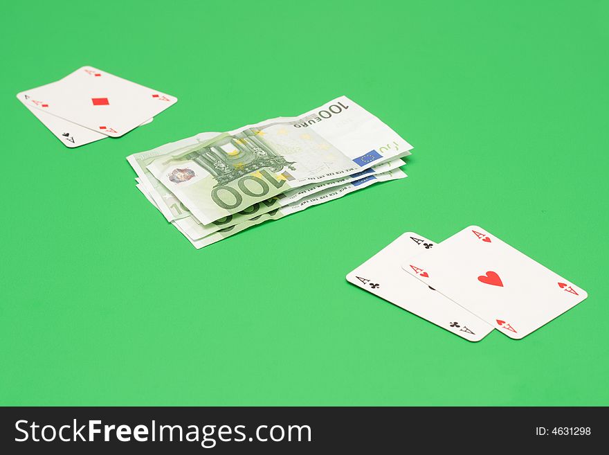 Poker cards vs euro money on green. Poker cards vs euro money on green