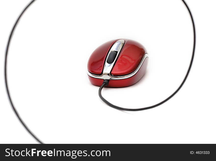 Red computer mouse with cable against white background