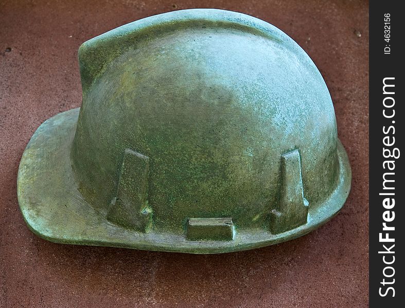 Modern outdoor bronze bas-relief - fireman's helmet. Modern outdoor bronze bas-relief - fireman's helmet