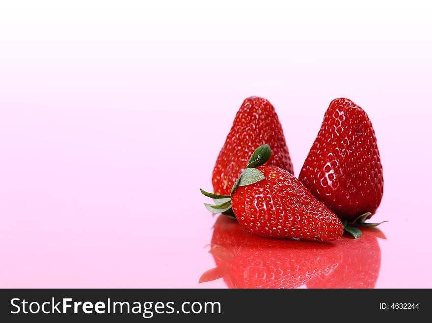 Three fresh and ripe strawberries