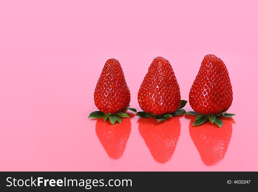 Three fresh and ripe strawberries