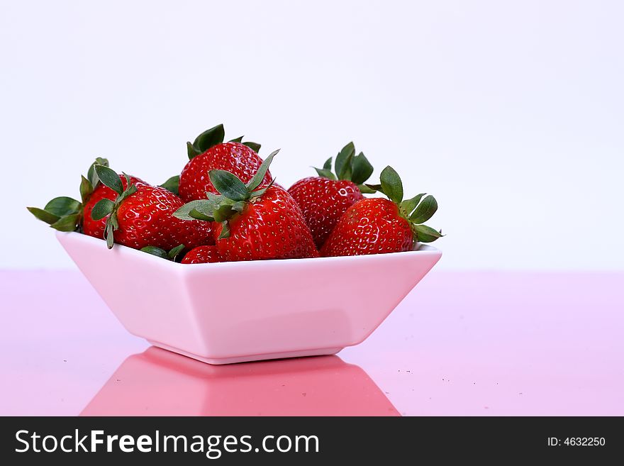 Fresh strawberries in white cup