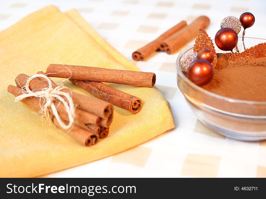 Festive cinnamon sticks tied in a bough on a napkin