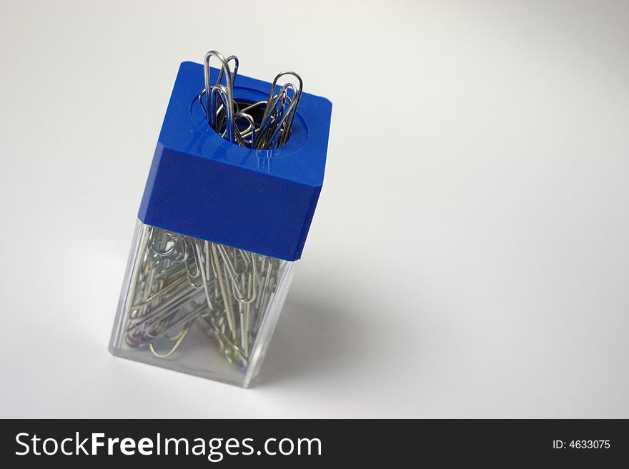 A container of paper clips filled up. A container of paper clips filled up