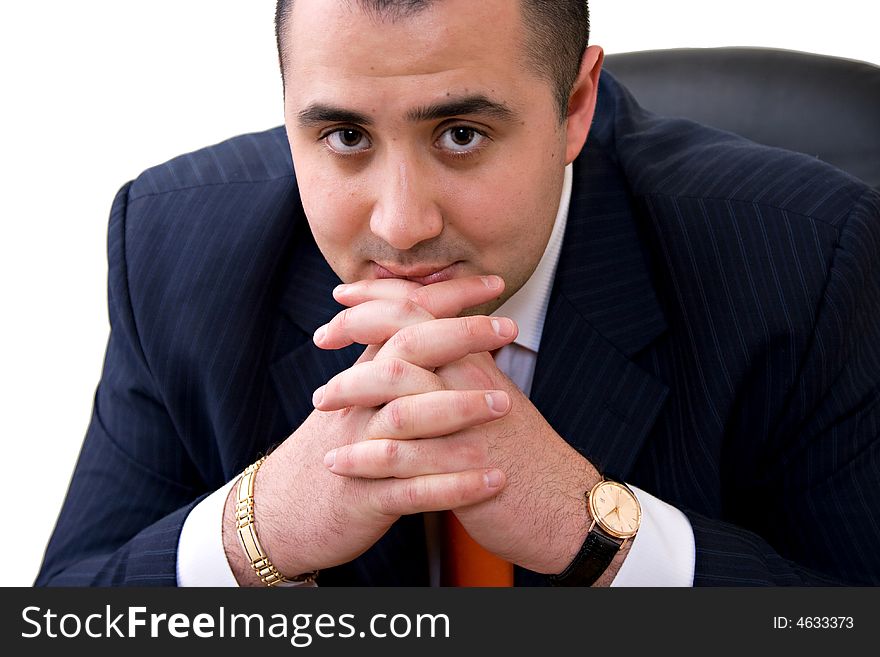 Business man sitting on the chair thinking with hands on his chin