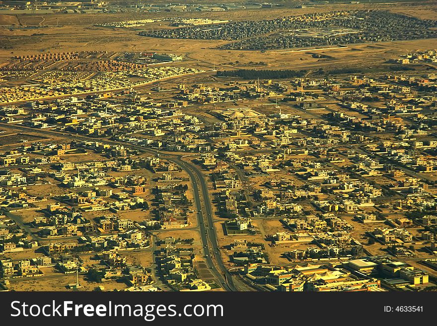 Morning. The typical East old city in desert area  is crossed by roads .  Aerial view .  Morning. The typical East old city in desert area  is crossed by roads .  Aerial view .