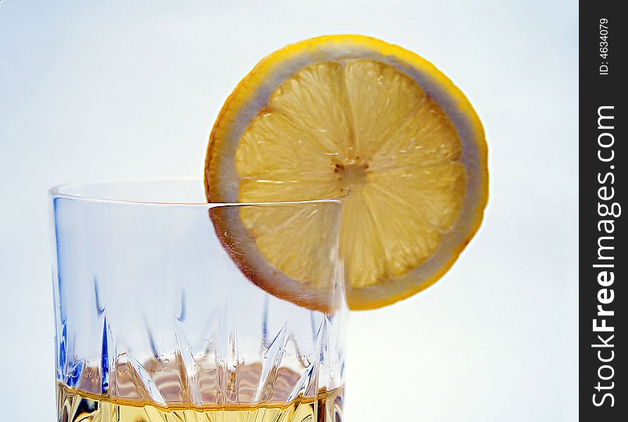 Lemon slice on the glass with lemonade