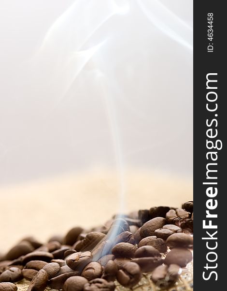 Roasted coffee beans with rising smoke