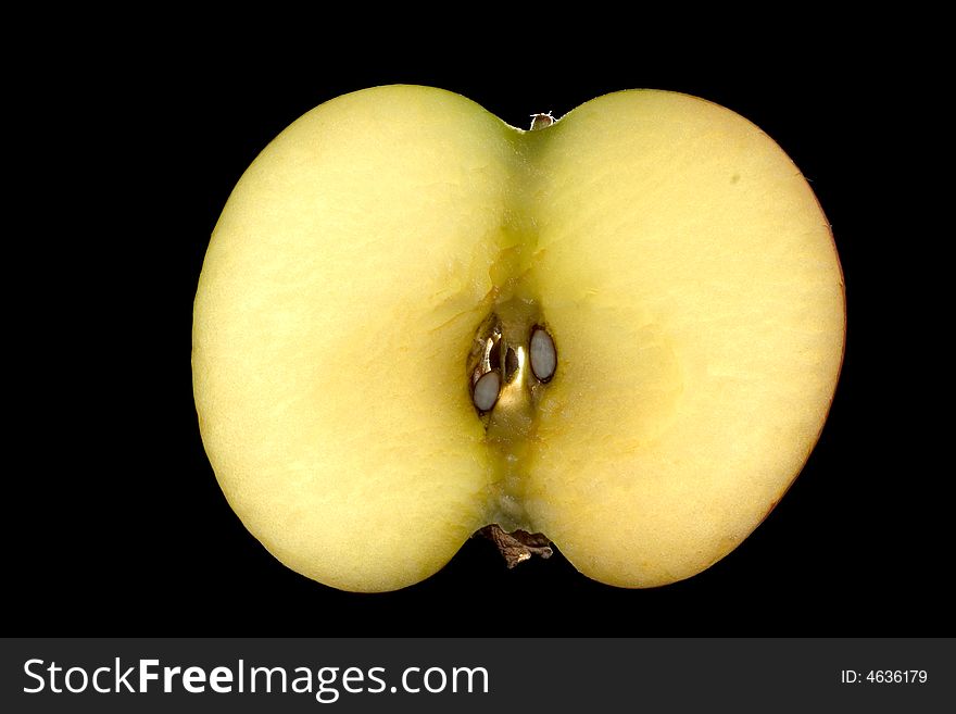 Slice of apple isolated on a black background