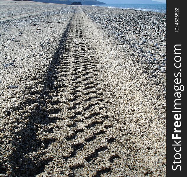 Car traces on the beach. Car traces on the beach