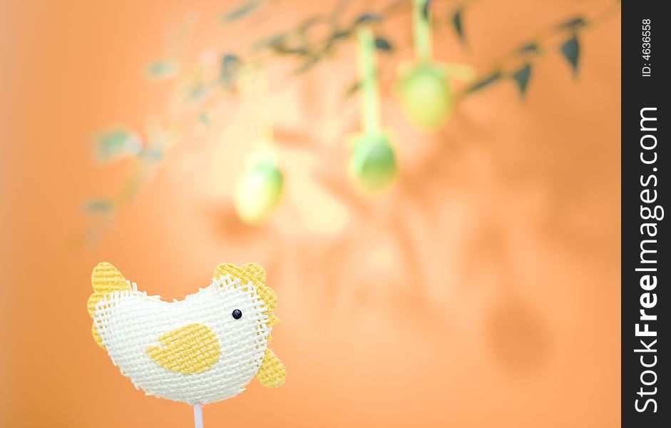 Easter chicken and easter egg / orange background