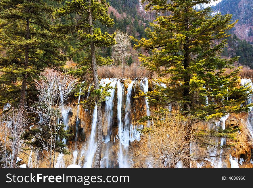 China still beautiful Jiuzhaigou scenic winter, the frozen waterfall in the forest