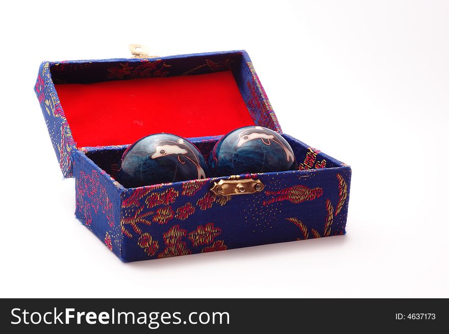 Chinese baoding balls stored in an ornate case. Chinese baoding balls stored in an ornate case