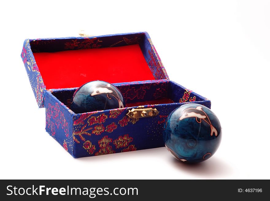 Baoding balls with ornate case - one inside and one outside. Baoding balls with ornate case - one inside and one outside