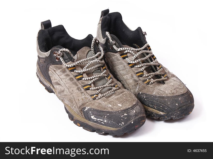 Old and dirty shoes isolated on white background