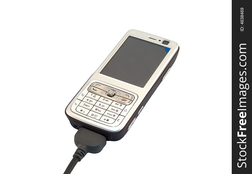 Cell phone connected to usb isolated on white