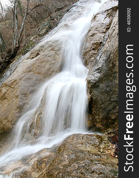 A beautiful waterfall is in the Crimean mountains