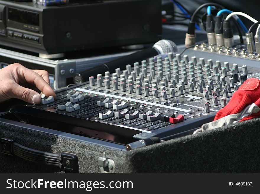 Audio mixer placed outdoor for stadium concert.