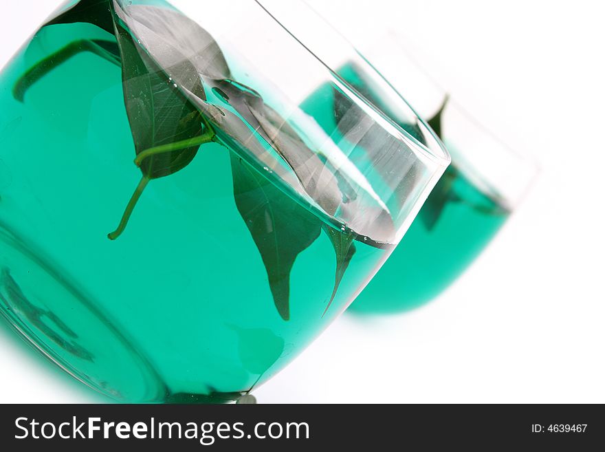 Dry leaves of green tea on white background