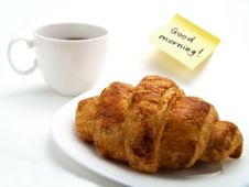 A Croissant, A Cup Of Coffee And A Yellow Note Stock Photography A Croissant, A Cup Of Coffee And A Yellow Note Stock Photography