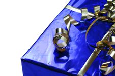 Shiny Blue Gift With Gold Ribbons Royalty Free Stock Photography