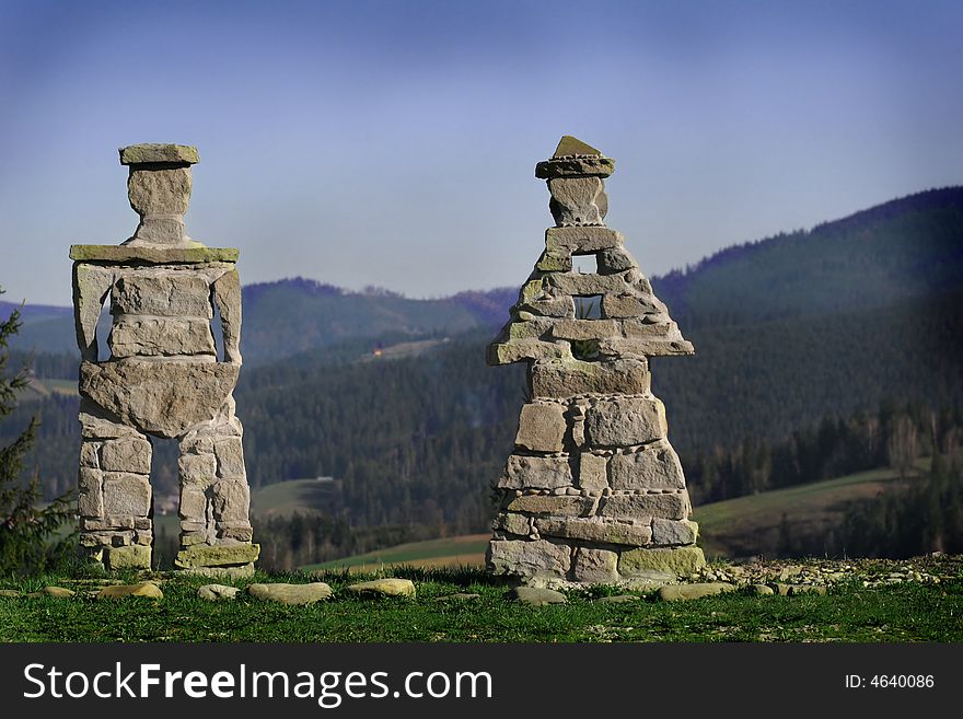 Two stone statues in the high mountains