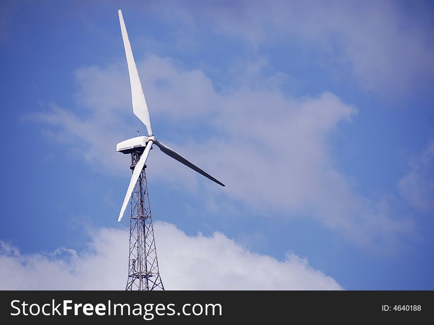 A wind turbine in operation Economic
