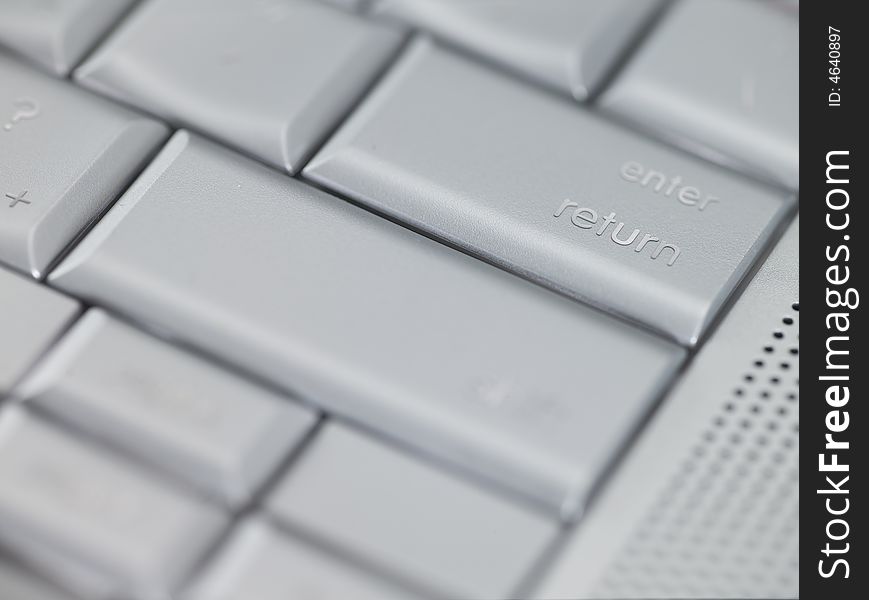 Macro Photo of a Keyboard focused on enter return key. Macro Photo of a Keyboard focused on enter return key