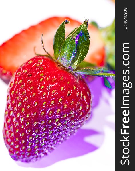 High key macro shot of ripe strawberries with funky lighting. High key macro shot of ripe strawberries with funky lighting