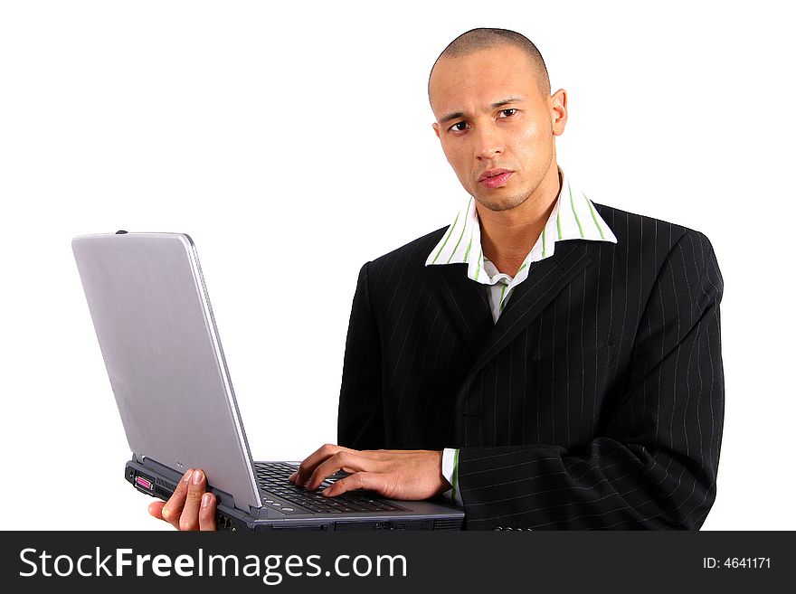 Stylish young man in suit working on his laptop. Isolated over white. Stylish young man in suit working on his laptop. Isolated over white.