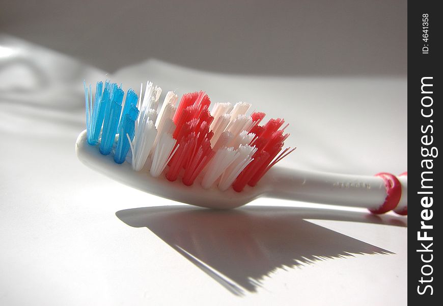 Blue red white tooth brush