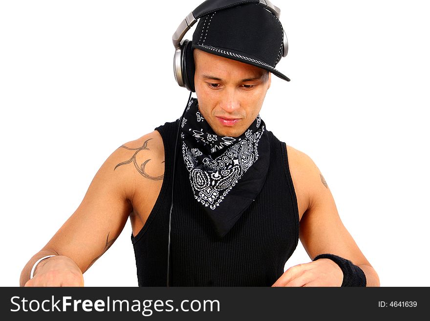 A young DJ with headphones in black with tattoo. A young DJ with headphones in black with tattoo.