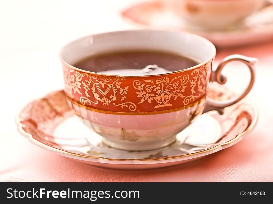 Pink still life with cup of tea