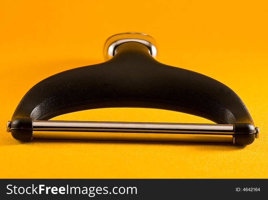 Wire Cheese Slicer against a yellow background