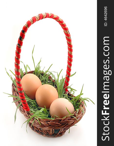 Basket with grass and three eggs. Basket with grass and three eggs