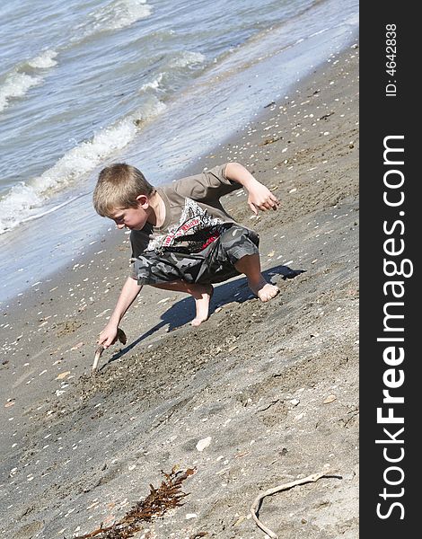 Male child having fun at the beach. Male child having fun at the beach