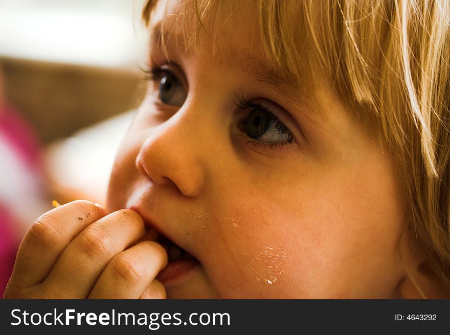 Close up of a young girl eating
