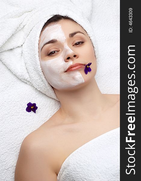 Young pretty woman getting facial mask, lot of copyspace. Young pretty woman getting facial mask, lot of copyspace