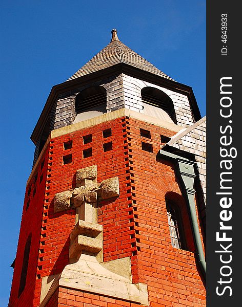 Cross on Church Bell Tower overlooking Downtown Center in Stockton, California