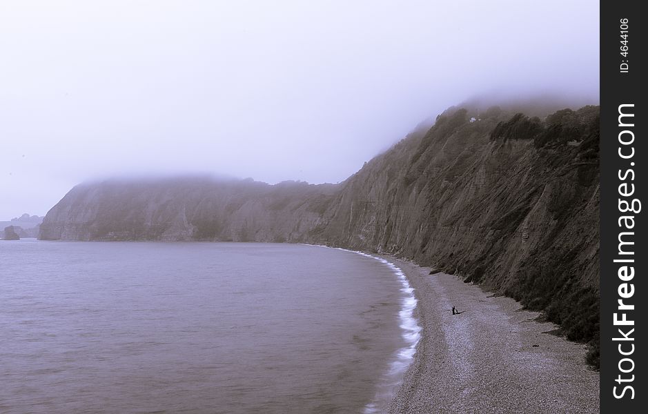 Foggy beach and coastline at Sidmouth in Devon UK. Foggy beach and coastline at Sidmouth in Devon UK