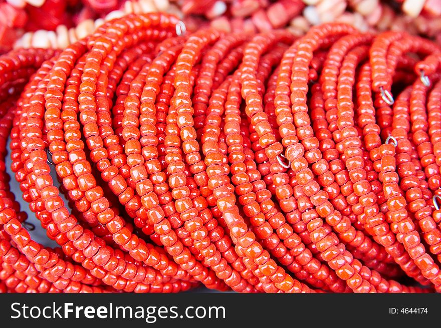 A shot of bracelet make of red beads,handmade.